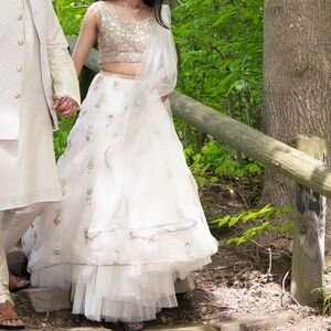 Payal Singhal ivory net lehenga, blouse, and dupatta